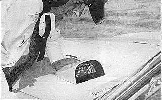 Jackie Stewart inspects hood tach